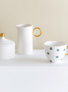 Melkkan wit en goud detail