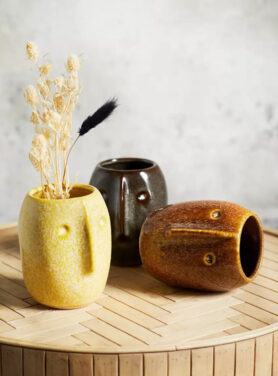 Madam Stoltz bloempotten gezicht zwart bruin geel