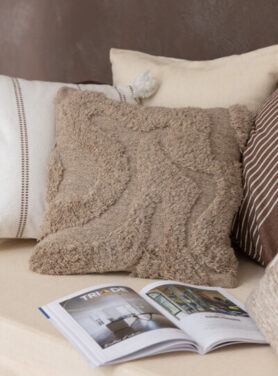 Beige Kleurige Kussentjes Met Rondingen Op Het Kussen